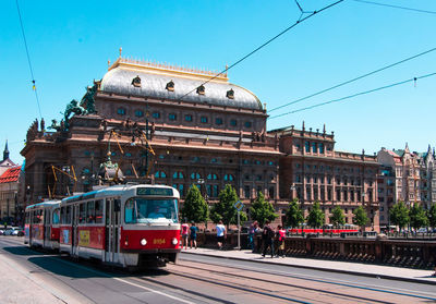 Train at railroad station against clear blue sky