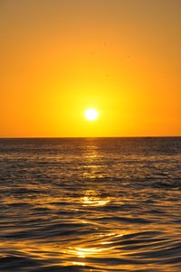 Scenic view of sea at sunset