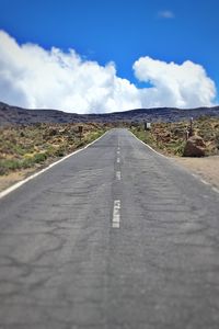 Road amidst landscape against sky