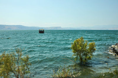 Scenic view of bay against clear sky