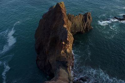 High angle view of rock formation in sea