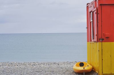 Close-up of beach against sky