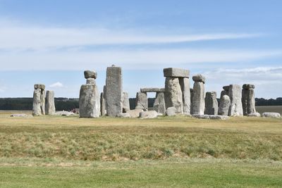 Built structure on field against sky