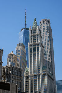 Low angle view of skyscrapers against clear sky