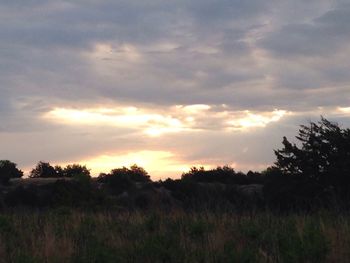 Scenic view of landscape against cloudy sky