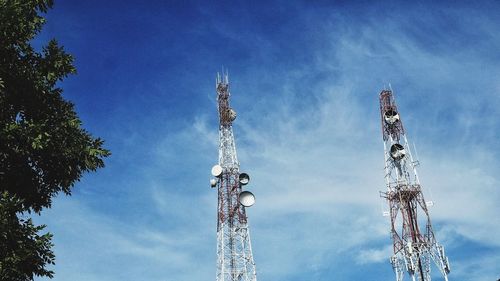 Low angle view of communications tower against sky