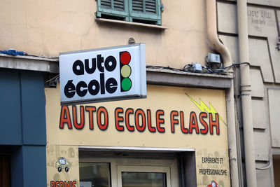 Low angle view of information sign on building