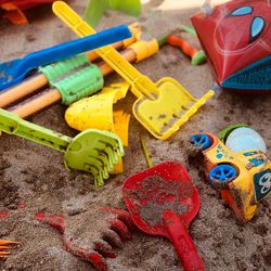 High angle view of toys in sand