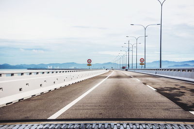 Road against cloudy sky