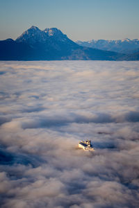 Fortress hohensalzburg rising above a sea of clouds, salzburg, austria