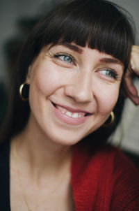 Close-up portrait of a smiling young woman