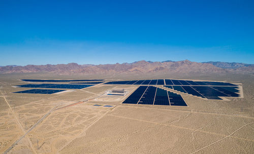 Solar panel produces green, environmentaly friendly energy from the setting sun. aerial view