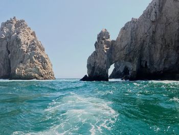 Scenic view of sea against clear blue sky