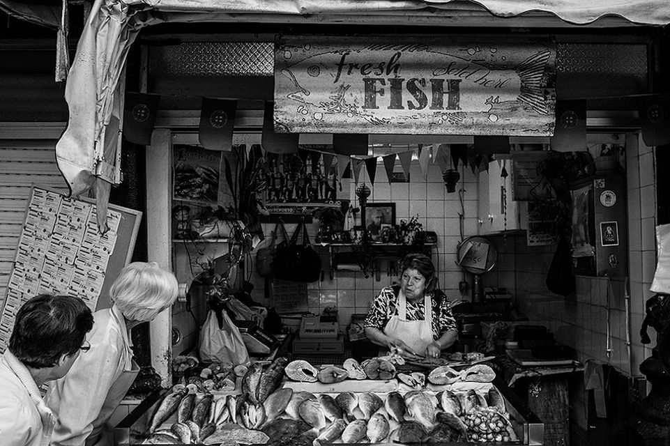 men, retail, market, indoors, for sale, market stall, lifestyles, person, small business, store, occupation, leisure activity, shop, working, selling, shopping, display, consumerism