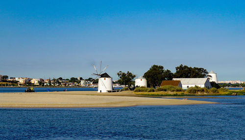 Scenic view of sea against clear blue sky