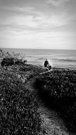 Scenic view of sea against cloudy sky