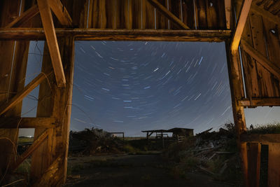 Low angle view of abandoned building against sky at night