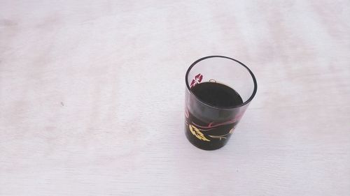 High angle view of drink in glass on table