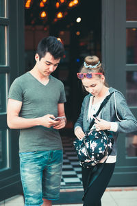 Young couple standing outdoors