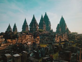 Panoramic view of temple against buildings