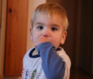 Portrait of cute baby boy at home