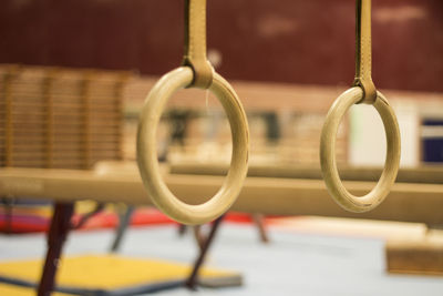 Close-up of metal hanging against wall