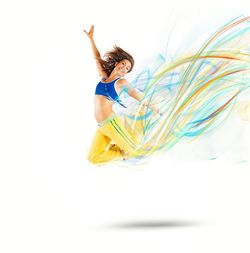 Woman jumping against white background