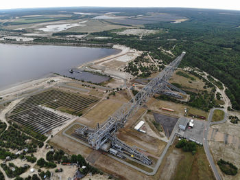 High angle view of river amidst city against sky