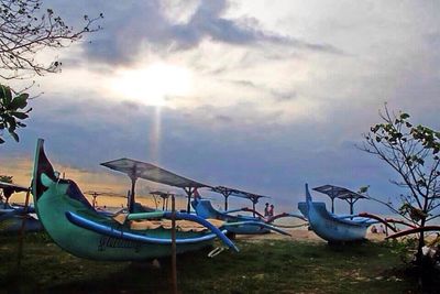 Scenic view of sea against cloudy sky at sunset