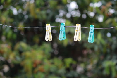 Clothespins hanging on clothesline