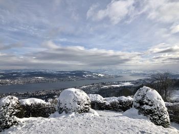 Snow covered landscape against sky