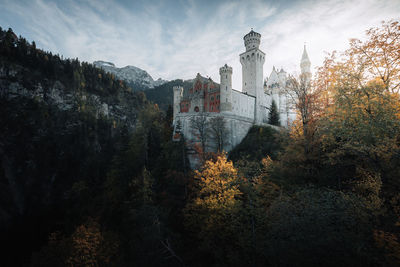 Panoramic view of trees and buildings against sky during autumn