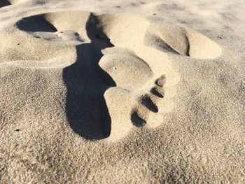 High angle view of shadow on sand