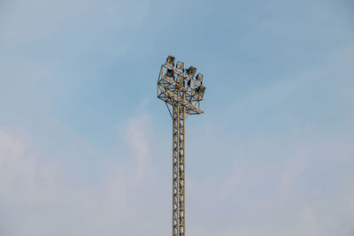 Low angle view of communications tower against sky