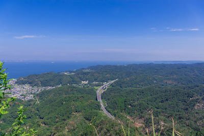 Scenic view of landscape against blue sky