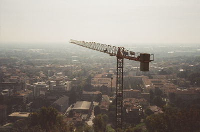 Aerial view of city against clear sky