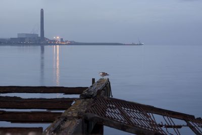 Pier by sea against sky