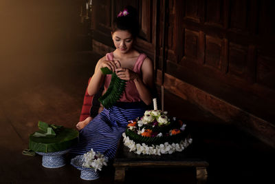 Young woman celebrating loi krathong