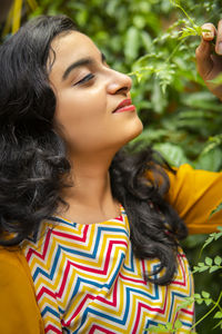 Close-up of young woman looking away