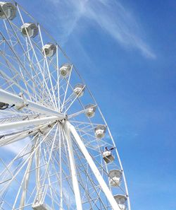 Low angle view of ferris wheel against sky