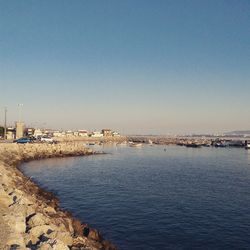 Calm sea against clear sky