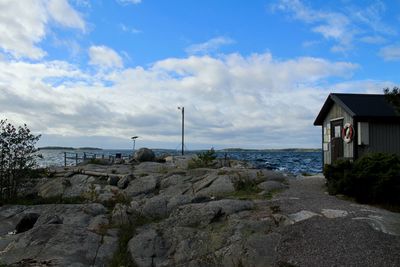  view of sea by buildings against sky