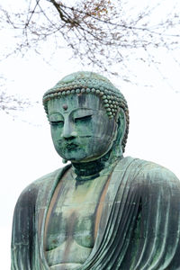 Close-up of statue against sky