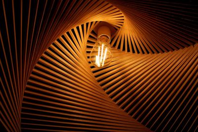 Low angle view of illuminated light bulb in decoration