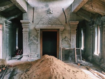 Heap of sand in of abandoned building