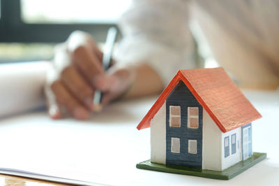Close-up of hand on table in building