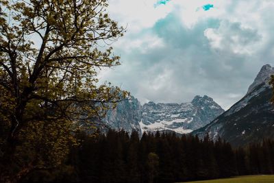 Scenic view of snowcapped mountains against sky