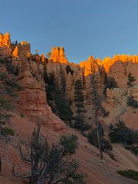 Rock formations on landscape against clear sky