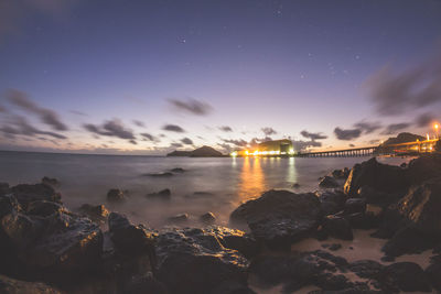 Scenic view of sea against sky at night