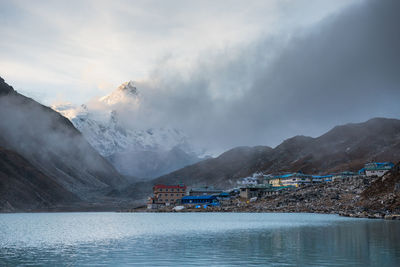 Scenic view of lake and mountains against sky